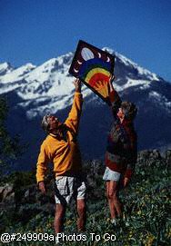 Adult couple over 35 flying a kite